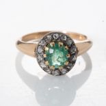 AN EMERALD AND DIAMOND RING