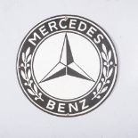 A MERCEDES-BENZ SIGN