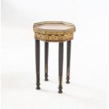 AN EBONISED AND GILT-METAL MOUNTED OCCASIONAL TABLE