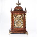 A OAK AND GILT-METAL TABLE CLOCK