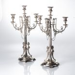 A PAIR OF CONTINENTAL ELECTROPLATE FOUR-LIGHT CANDELABRA