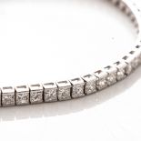 A DIAMOND TENNIS BRACELET