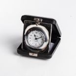 A SILVER TRAVELLING ALARM CLOCK