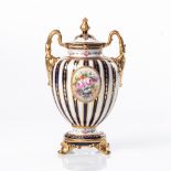 A ROYAL CROWN DERBY TWO-HANDLED URN AND COVER