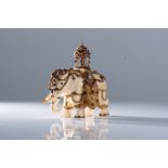 AN ANTIQUE IVORY AND MULTI-GEM ELEPHANT