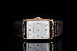 GENTLEMANS VINTAGE 18K ROSE GOLD PATEK PHILIPPE, oblong, silver dial with gold hands, gold baton and