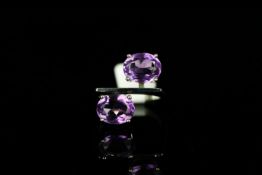 Bucherer Amethyst ring w/box, set with 2 oval cut amethysts, 1 measuring approximately 10.22mm x 8.
