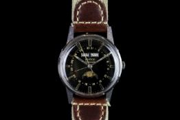 GENTLEMANS ZODIAC,round, black dial with illuminated hands, gold baton markers,day-date at 12 o