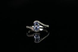 14ct White Gold Sapphire and Diamond ring featuring centre, oval cut, light blue Sapphire (0.