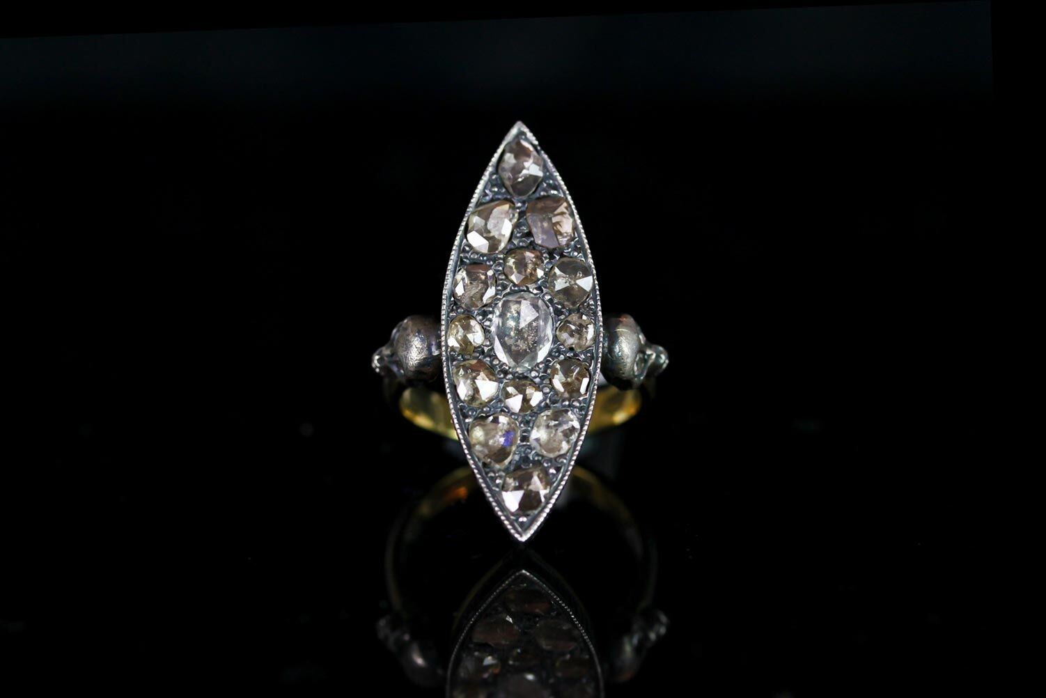 Rose cut diamond ring, silver marquise shape panel set with 15 rose cut diamonds, 2 skulls set