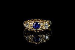George V, Sapphire and Diamond carved half hoop ring, central 4.4mm blue sapphire, with old cut