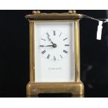 TIFFANY & CO CLOCK, white dial with roman numerals and gun metal blue hands, brass case with glass