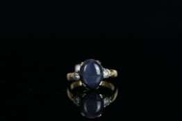 18CT STAR SAPPHIRE AND DIAMOND RING,centre stone estimated at 7ct, 2x diamonds estimated at 0.20ct