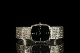 GENTLEMENS PIAGET 18CT WHITE GOLD DIAMOND SET WRISTWATCH, black double diamond dot hour markers