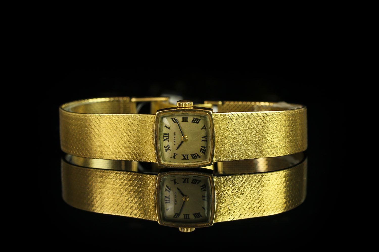 LADIES CARTIER 18CT GOLD WRISTWATCH, square aged dial with black roman numerals and hands, 17mm 18ct
