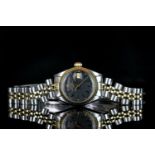 LADIES TWO TONE ROLEX DATEJUST,round,black dial with gold hand, gold markers, date aperture at 3 o