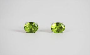 Pair of Peridot stud earrings, set with an oval cut peridot each, 4 claw set, stamped sterling