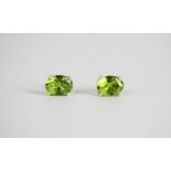 Pair of Peridot stud earrings, set with an oval cut peridot each, 4 claw set, stamped sterling