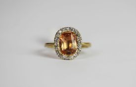 Imperial Topaz & Diamond ring, set with 1 oval cut imperial topaz approximately 2.05ct, surrounded