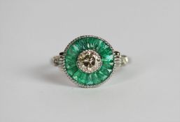 Emerald and Diamond target style ring, set with a diamond totalling approximately 0.50ct, surrounded