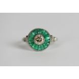 Emerald and Diamond target style ring, set with a diamond totalling approximately 0.50ct, surrounded