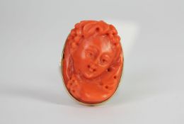 Coral cameo ring, carved coral cameo 22.5x16.5mm, mounted in 18ct, circa early 20th century