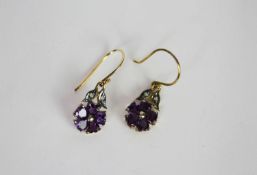 Pair of Amethyst and Diamond drop earrings, flower design, set with a total of 10 amethysts and 4