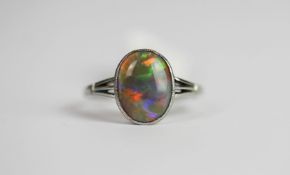 Opal ring, set with 1 oval cut Opal approximately 0.92ct, finger size M, approximate total weight