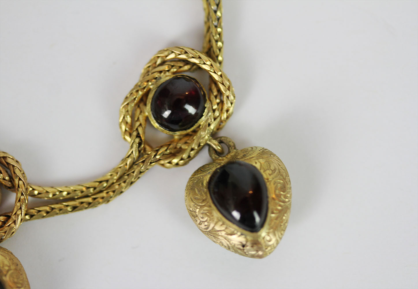Garnet set charm bracelet, set with a total of 9 cabochon garnets, 4 dangling heart charms, not - Image 2 of 3
