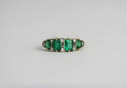 Edwardian Emerald and diamond carved half hoop ring, four rectangular cushion cut Emeralds,