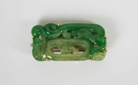 Jadeite brooch, set with a jadeite decorative panel estimated 41.90ct, stamped 18ct yellow gold