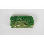 Jadeite brooch, set with a jadeite decorative panel estimated 41.90ct, stamped 18ct yellow gold