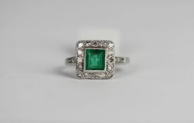 Emerald and diamond cluster ring, square cut emerald a border of round cut diamonds, diamond set
