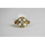 Pearl and Diamond ring, set with 4 pearls and 5 diamonds approximately 0.45ct, stamped 18ct yellow