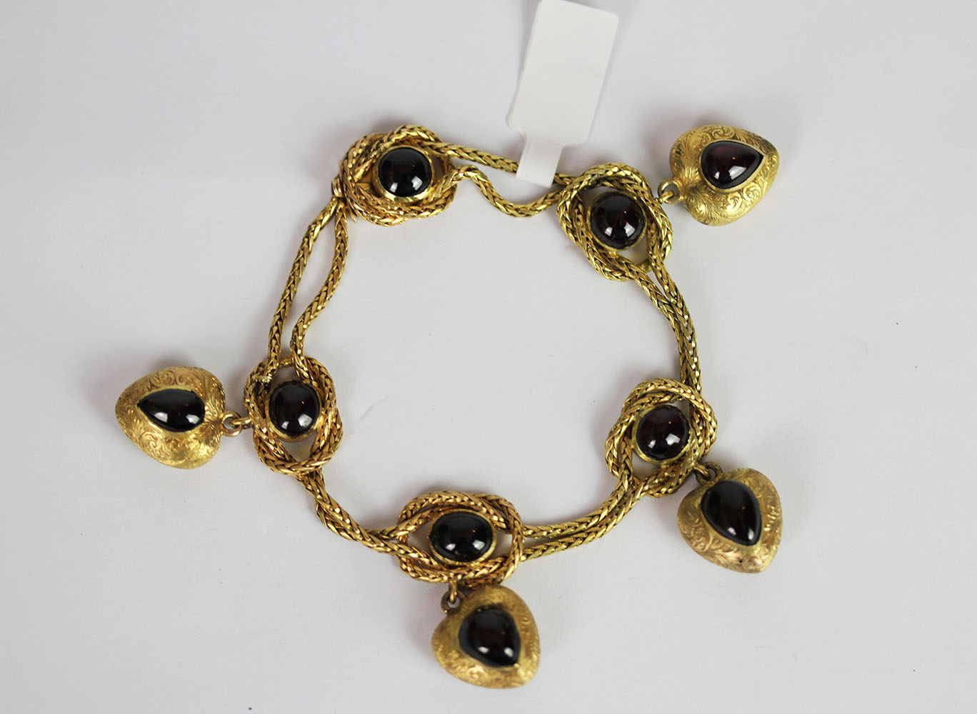 Garnet set charm bracelet, set with a total of 9 cabochon garnets, 4 dangling heart charms, not