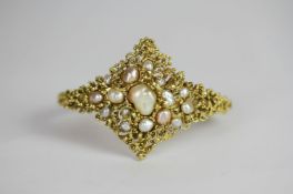 Baroque pearl gold bangle, Baroque pinkish white pearls, set within an intricate scrolling