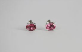 Pair of Pink Tourmaline stud earrings, each set with an oval cut pink tourmaline, 4 claw set,