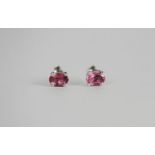 Pair of Pink Tourmaline stud earrings, each set with an oval cut pink tourmaline, 4 claw set,