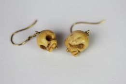 9CT BONE SKULL DROP WIRE EARRINGS.