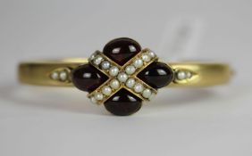 Victorian Garnet and Pearl hinged bangle, four oval cabochon garnets, closed back settings,