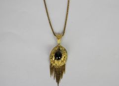 Victorian Cabochon Garnet Tassel pendant, central 10.5x9mm cabochon garnet, oval gold mount with