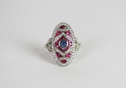 Art Deco-style Ruby, Diamond & Sapphire ring, set with 1 cabochon cut sapphire, surrounded by rubies