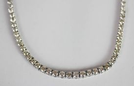 Graduated Diamond riviere line necklace, set with round brilliant cut diamonds totalling