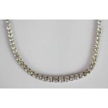 Graduated Diamond riviere line necklace, set with round brilliant cut diamonds totalling