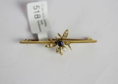 Sapphire, Diamond and Pearl set bug brooch, central sapphire body, set atop a yellow gold bar,