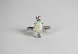 Opal & Diamond ring, set with 1 opal approximately 1.35ct, 8 claw set, surrounded by 2 round