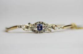 Sapphire and Diamond bangle, set with 1 emerald cut sapphire approximately 0.30ct, 8 claw set,