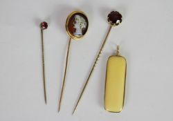 3x stick pins and a carved bone pendant, Garnet foil backed stick pin, Cameo and Garnet examples,