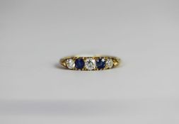 Victorian sapphire and diamond carved half hoop ring, three old cut diamonds, estimated total weight