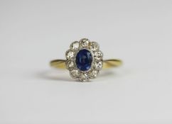 Sapphire and diamond cluster ring, central oval cut sapphire, 10 round cut diamonds, estimated total